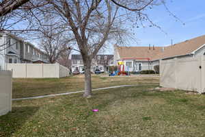 View of yard with a playground and a residential view