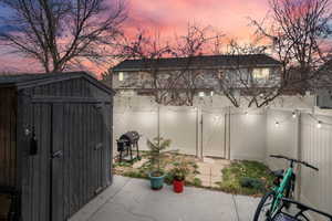 View of shed featuring a gate