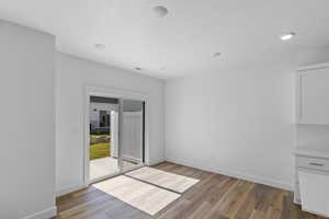 Spare room featuring light wood-style floors and recessed lighting