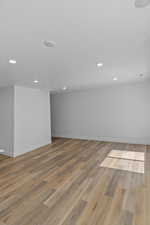 Unfurnished room with light wood-style flooring and recessed lighting