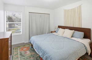 Bedroom featuring carpet floors and a closet