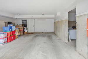 Garage featuring washer / clothes dryer