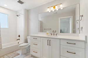 Full bathroom featuring vanity and shower / bath combo