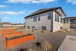 View of property exterior with a vegetable garden