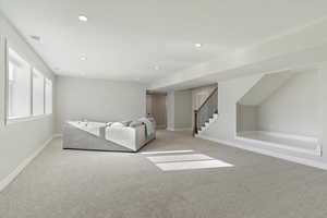 Carpeted bedroom featuring baseboards and recessed lighting