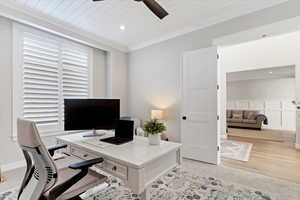 Office area featuring a ceiling fan, a decorative wall, recessed lighting, wood ceiling, and ornamental molding