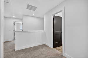 Unfurnished room featuring light colored carpet and recessed lighting