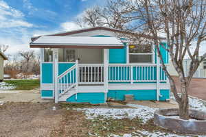View of front of house with covered porch