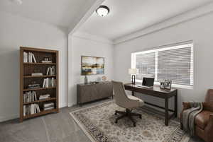 Home office with light carpet and baseboards