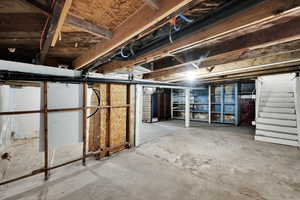 Unfinished basement with stairs