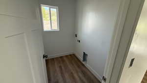 Laundry area with hookup for a washing machine and wood finished floors