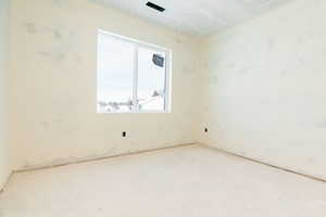 Empty room with a textured ceiling