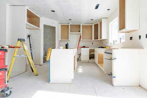 Kitchen with a textured ceiling