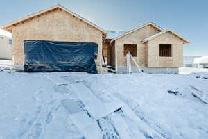 Unfinished property with stucco siding