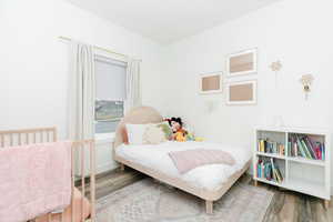 Bedroom featuring wood finished floors