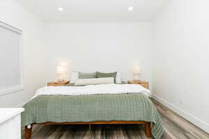 Bedroom featuring wood finished floors and recessed lighting