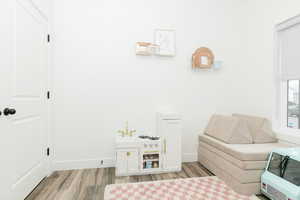 Living area featuring light wood-style floors