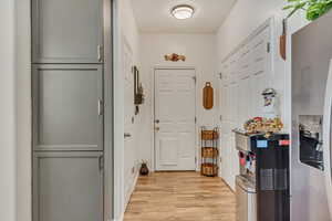 Doorway to outside with wood finished floors