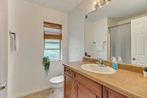 Ensuite Bathroom Bedroom 2 featuring vanity, a shower with shower curtain, and light tile patterned floors