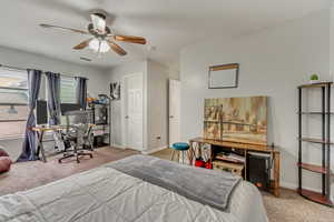 Bedroom 2 featuring an office area, carpet, and ceiling fan