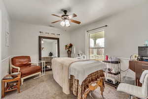 Bedroom 1 Carpeted bedroom with a ceiling fan