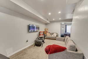 Downstairs Suite Living area featuring recessed lighting and carpet flooring