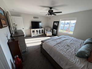 Bedroom with carpet floors and ceiling fan
