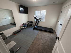 Workout room with a textured ceiling