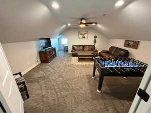 Rec room featuring lofted ceiling, carpet, a ceiling fan, and recessed lighting
