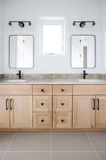 Bathroom featuring double vanity and tile patterned floors