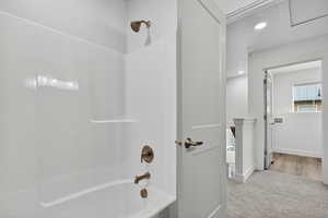 Full bathroom featuring recessed lighting, shower / bathtub combination, and light carpet