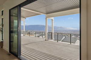 Wooden terrace with a patio area and a mountain view