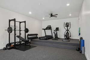 Exercise area featuring a ceiling fan and recessed lighting