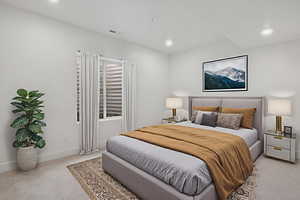 Bedroom featuring light colored carpet and recessed lighting