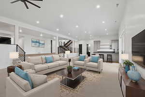 Carpeted living area featuring recessed lighting and ceiling fan