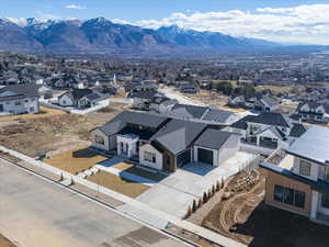 Aerial perspective of suburban area featuring a mountain backdrop