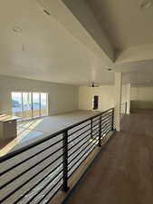 Hall with recessed lighting and dark wood-type flooring