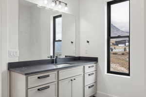 Bathroom with vanity and a mountain view