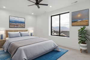 Bedroom with light colored carpet, ceiling fan, and recessed lighting