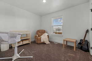 Bedroom with baseboards and carpet