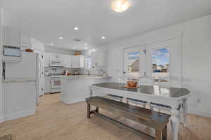 Dining room featuring recessed lighting and light wood finished floors