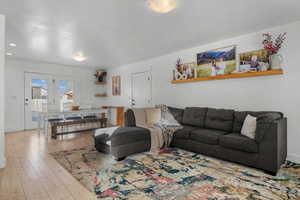 Living area featuring hardwood / wood-style flooring and baseboards