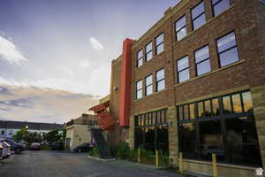 Property at dusk featuring stairs