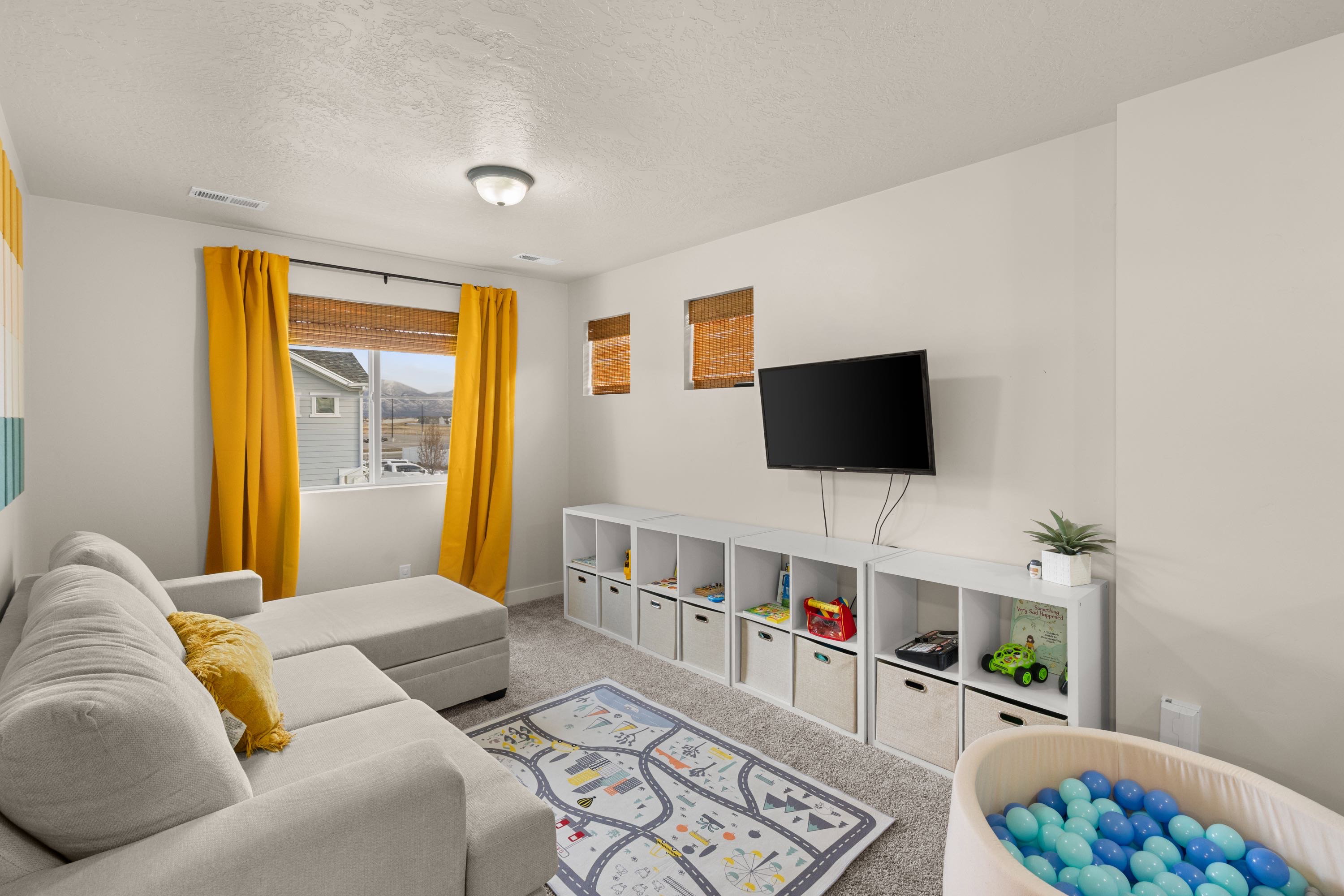 Carpeted living area with a textured ceiling