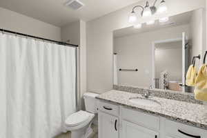 Full bath featuring vanity and a shower