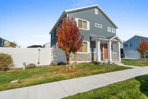 View of front of house with stone siding