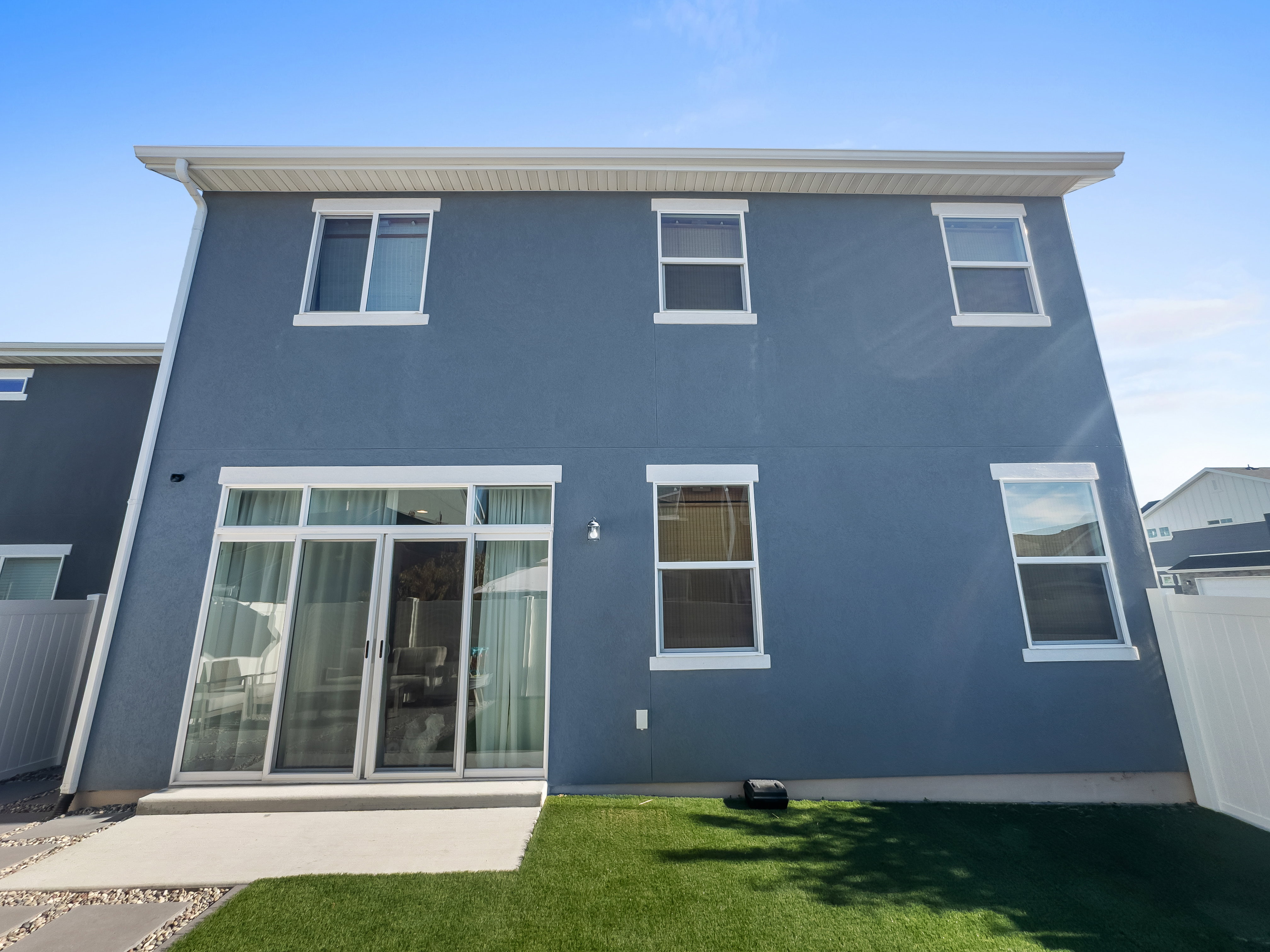Back of property with stucco siding