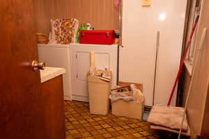 Laundry room featuring washing machine and clothes dryer