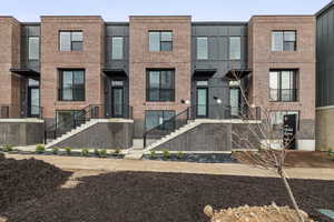 Contemporary home with brick siding
