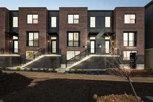 Contemporary home with brick siding